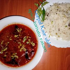 A picture of Spicy tomato 'rasam' 🍅🌶️🧄.