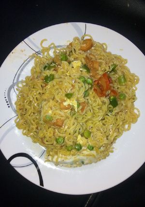 A picture of Indomie with vegetables and egg.