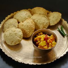 A picture of Spicy Luchi & Spicy Potato curry.