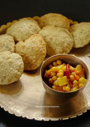 A picture of Spicy Luchi & Spicy Potato curry.