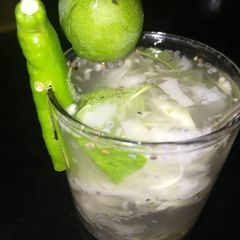 A picture of Tender coconut with mango punch.