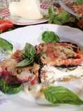 Melanzane gratinate in forno con provola dolce, parmigiano, pomodoro fresco, basilico