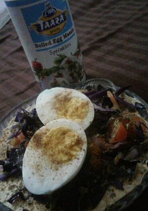 A picture of Masala papad with boiled egg.