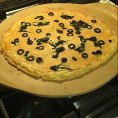 A picture of Potato Crust Pizza - with Alfredo sauce and Parmesan cheese.