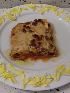 Una foto de Lasaña de calabaza con pistachos y granada
