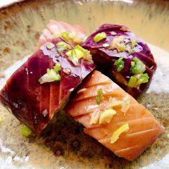 A picture of Steamed eggplant with soy sauce and ginger.