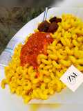 Yellow macaroni with stew