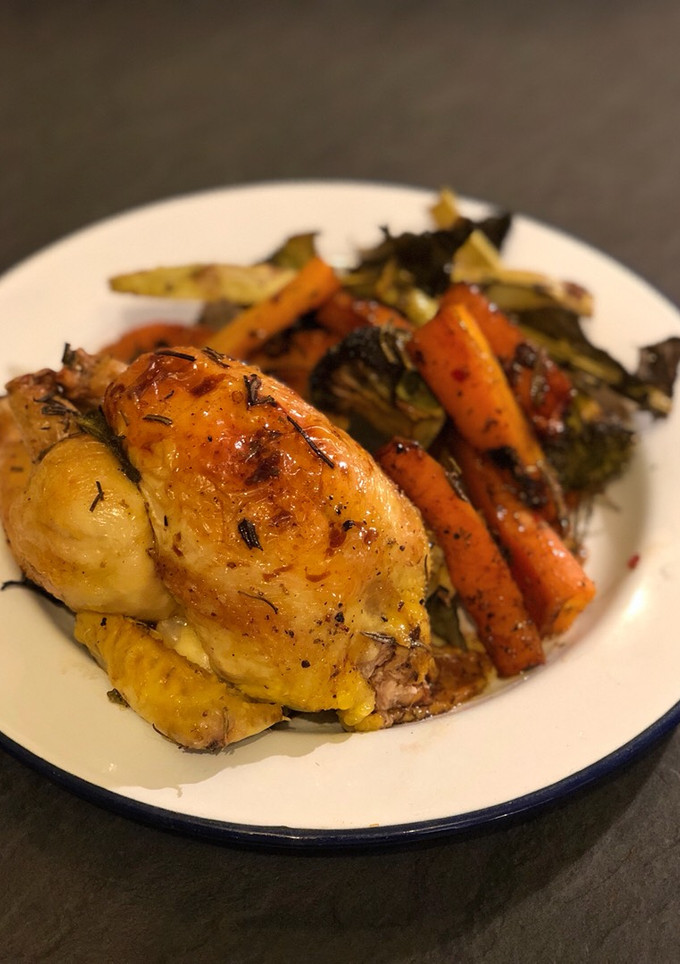 A picture of Roast poussin balsamic roast carrot and broccoli.