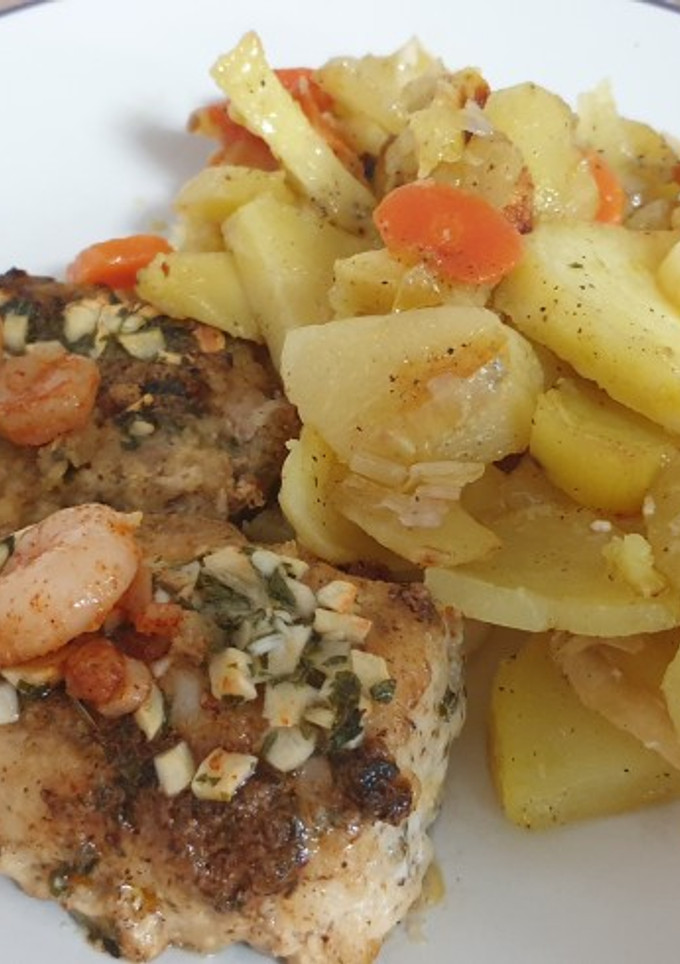 Una foto de Merluza con gambas y ajo
