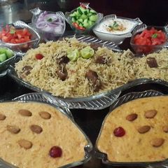 A picture of Beef pulao and gajrela with salad.