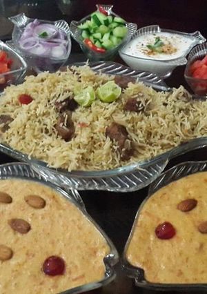 A picture of Beef pulao and gajrela with salad.