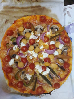 Una foto de Pizza vegetariana