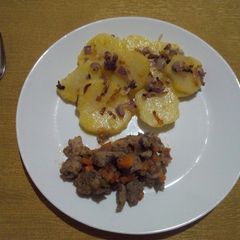 A picture of Lyonnaise Potatoes and Fried Pork.
