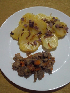 A picture of Lyonnaise Potatoes and Fried Pork.
