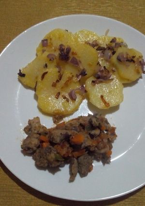 A picture of Lyonnaise Potatoes and Fried Pork.