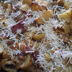 Over baked Chicken with Potatoes, Mushrooms and Onions A picture of Over baked Chicken with Potatoes, Mushrooms and Onions.