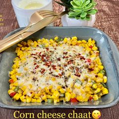 A picture of Corn cheese chaat.