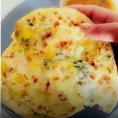 A picture of Aaloo Paratha(flavoured potato stuffed Indian flat bread).
