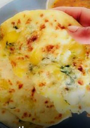 A picture of Aaloo Paratha(flavoured potato stuffed Indian flat bread).