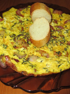 Una foto de Tortilla de huevos de pava con bacon, cebolla morada y tomillo