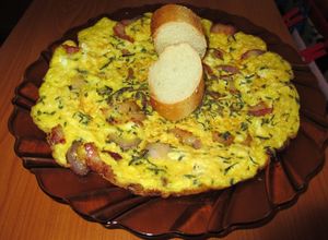 Foto principal de Tortilla de huevos de pava con bacon, cebolla morada y tomillo