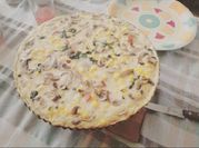 Una foto de quiche champiñones