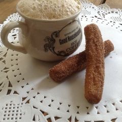 Cinnamon sugar churros and latte A picture of Cinnamon sugar churros and latte.