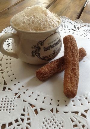 A picture of Cinnamon sugar churros and latte.