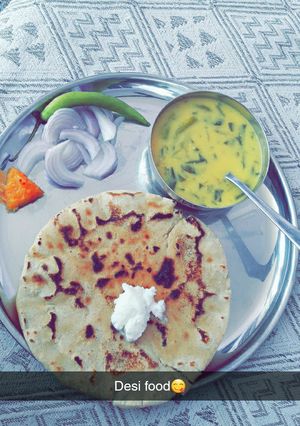 A picture of Punjabi Platter Makki Ki Roti and Kadhi.