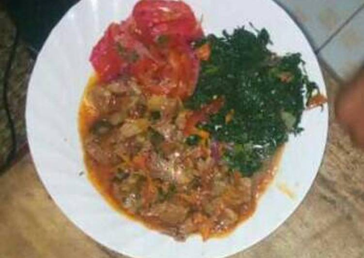 Beef stew with fried spinach and kachumbari