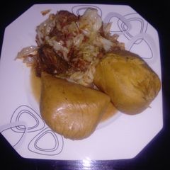 A picture of Moimoi Garnished with Cabbage beef stew.