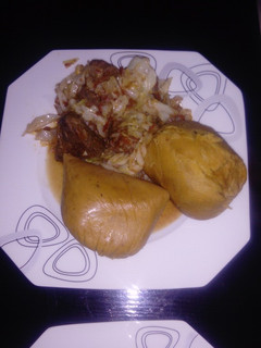 A picture of Moimoi Garnished with Cabbage beef stew.