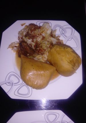 A picture of Moimoi Garnished with Cabbage beef stew.