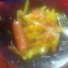 A picture of Chips sausage and salad.