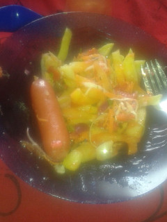 A picture of Chips sausage and salad.