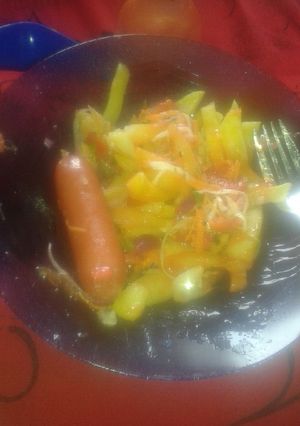 A picture of Chips sausage and salad.