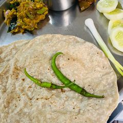 A picture of Jowar Bhakri and vegetable (Pendbhaji Bhakri).