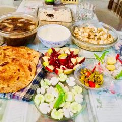 A picture of Dal Maharani,Mughlai Shahi Paneer,mirchi parathas.