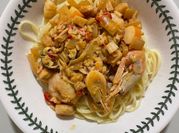 A picture of cream scallops and shrimp