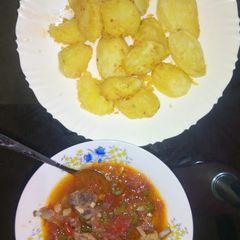 A picture of Fried potatoes and meat stew.