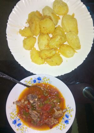 A picture of Fried potatoes and meat stew.