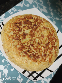 Una foto de Tortilla de patatas con cebolla