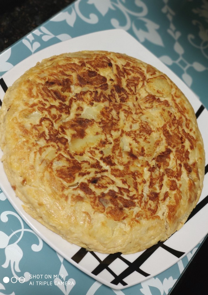 Una foto de Tortilla de patatas con cebolla