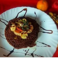 A picture of Chocolate Banana Peanut Fruit Pancake With Choco Sauce.