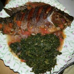 A picture of Wet fried fish with kienyeji.