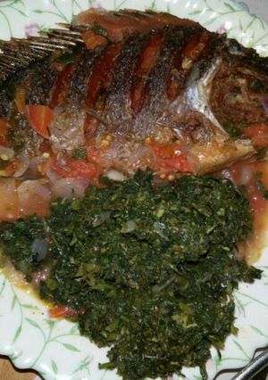 A picture of Wet fried fish with kienyeji.