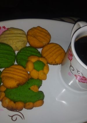 A picture of Coloured Cookies and Maltina.