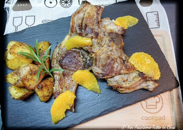 Costolette di agnello all'arancia con patate in padella