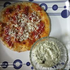 A picture of Schezwan uttapam.