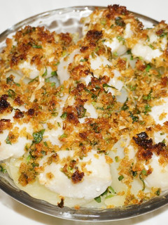 Una foto de Ostiones al broiler con papas a la mantequilla